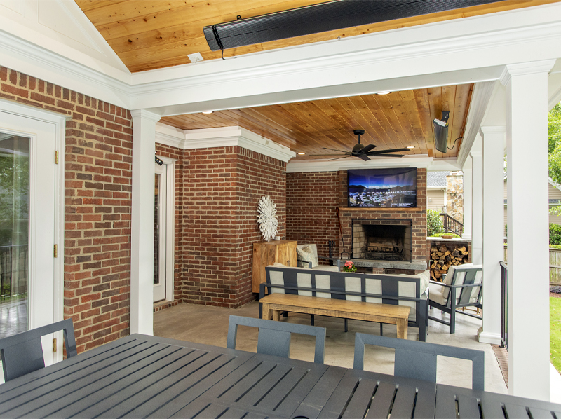 Outdoor living area with a fireplace and seating
